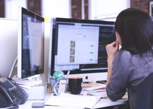 Remote worker coding in two computers